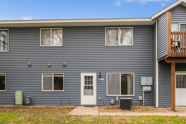 back of property featuring central AC unit