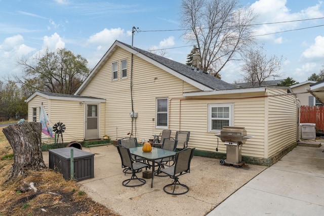 back of property with a patio area