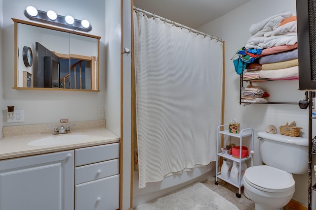 full bathroom featuring shower / bathtub combination with curtain, vanity, toilet, and tile patterned flooring