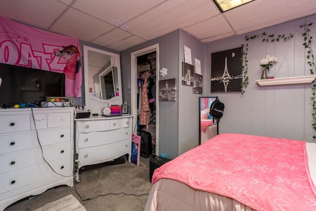 bedroom with carpet and a drop ceiling