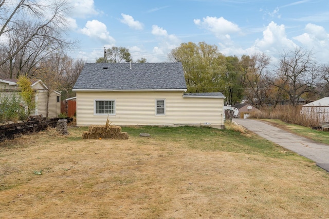 view of side of home featuring a lawn