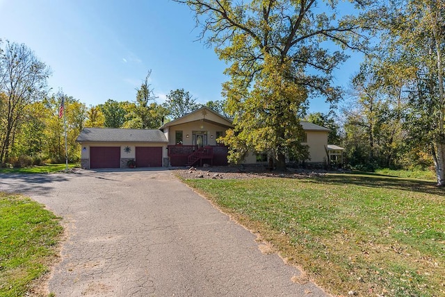 view of front facade with a garage and a front yard