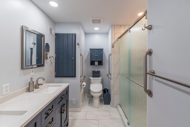 bathroom with an enclosed shower, vanity, and toilet