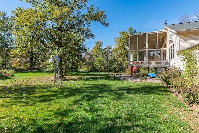 view of yard with a sunroom