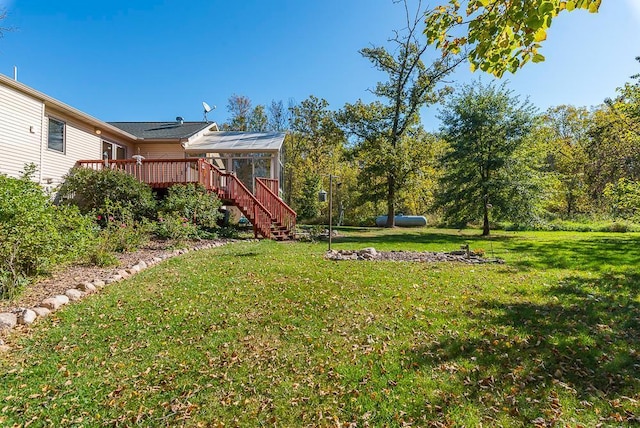 view of yard featuring a wooden deck