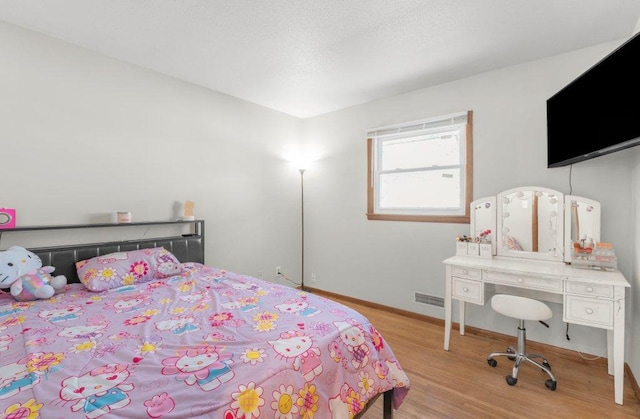 bedroom featuring light hardwood / wood-style floors