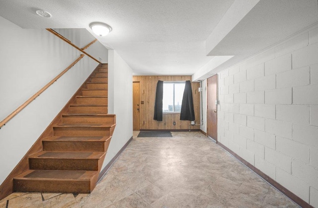 entrance foyer featuring a textured ceiling