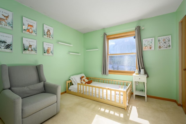 bedroom with carpet flooring and baseboards