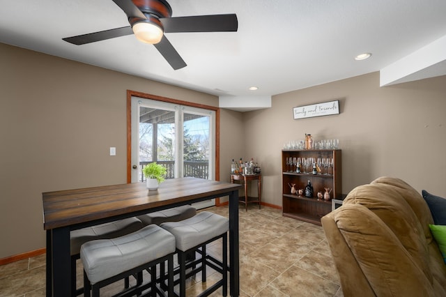 dining area with recessed lighting and baseboards