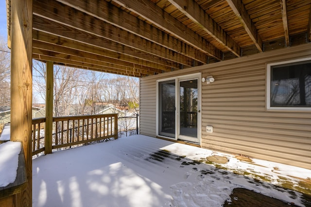 view of snow covered deck