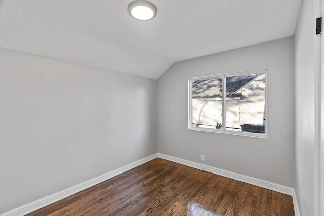 bonus room with dark hardwood / wood-style flooring and lofted ceiling