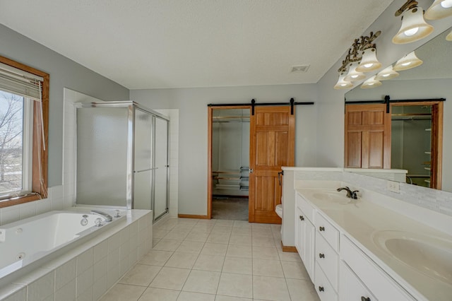 full bathroom with tile patterned flooring, vanity, plus walk in shower, a textured ceiling, and toilet