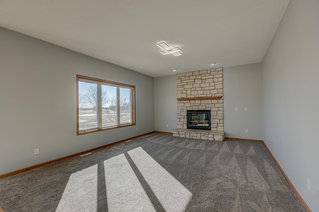 unfurnished living room featuring carpet floors and a fireplace