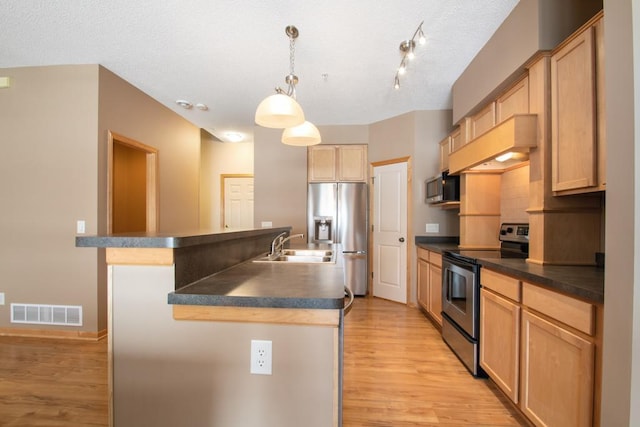 kitchen featuring stainless steel appliances, decorative light fixtures, custom exhaust hood, and light brown cabinets