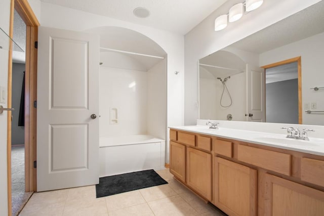 bathroom featuring tile patterned floors, separate shower and tub, and vanity