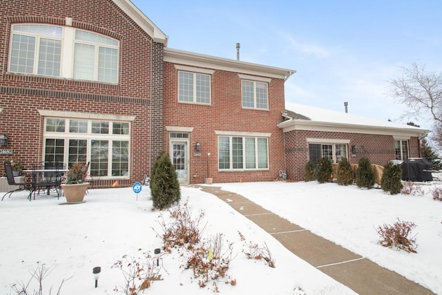 view of snow covered house