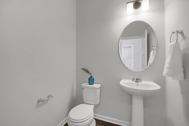 bathroom featuring sink and toilet