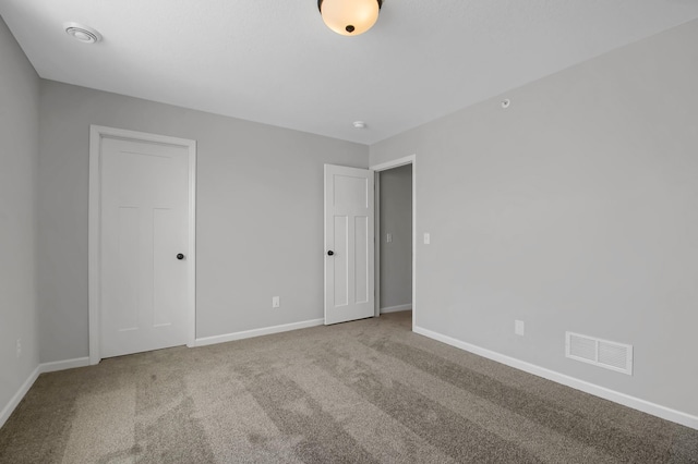 empty room with carpet flooring