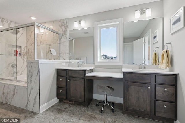 bathroom with vanity and walk in shower