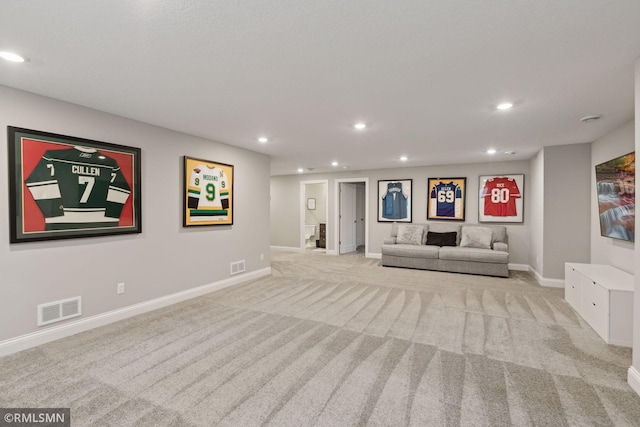 unfurnished living room with light carpet, baseboards, visible vents, and recessed lighting