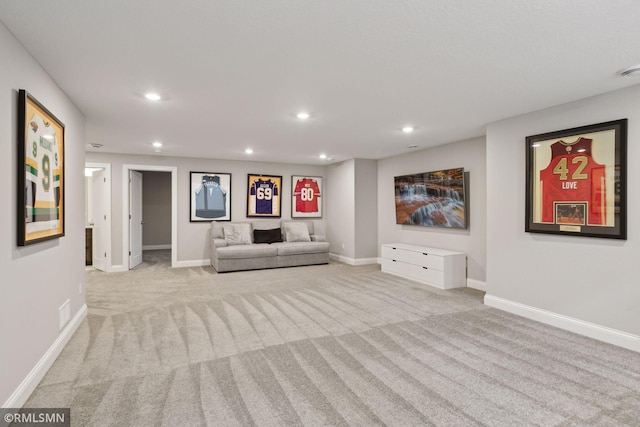 unfurnished living room with recessed lighting, baseboards, and light colored carpet