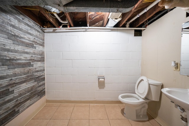 bathroom with tile patterned flooring and toilet