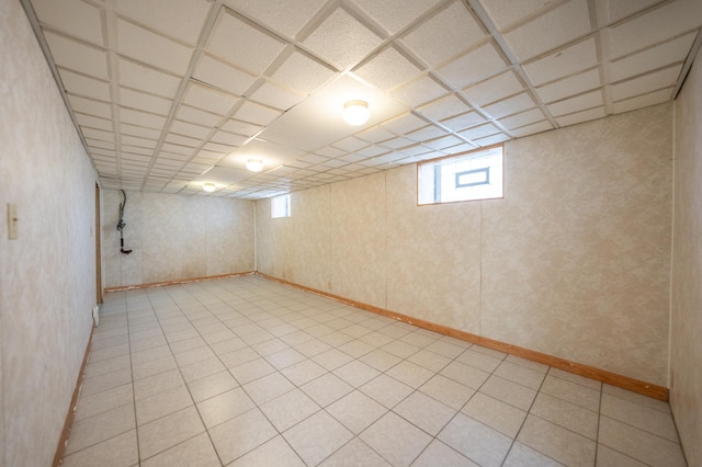 basement featuring a paneled ceiling