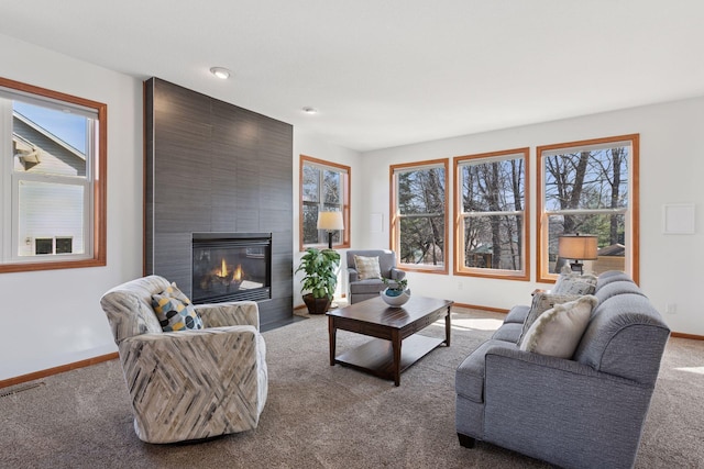 2536 Saunders Lake Dr, Minnetrista, MN 55364 - living area with carpet floors, baseboards, and a large fireplace
