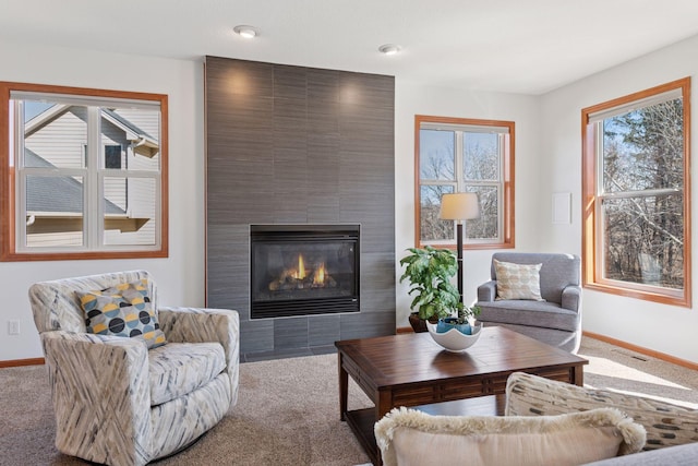 2536 Saunders Lake Dr, Minnetrista, MN 55364 - carpeted living room with a fireplace and baseboards