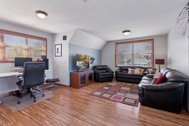 2536 Saunders Lake Dr, Minnetrista, MN 55364 - office area with wood finished floors and a textured ceiling