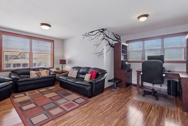 2536 Saunders Lake Dr, Minnetrista, MN 55364 - living area with wood finished floors and a desk