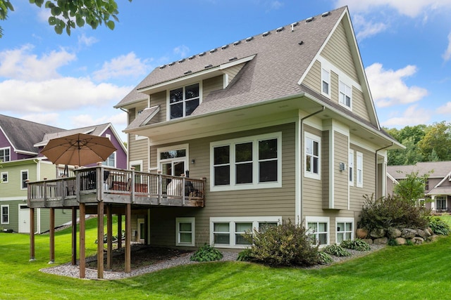 2536 Saunders Lake Dr, Minnetrista, MN 55364 - rear view of property with a deck, a yard, and a shingled roof