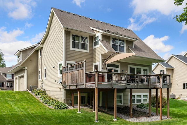 2536 Saunders Lake Dr, Minnetrista, MN 55364 - rear view of house featuring a garage, a wooden deck, a lawn, roof with shingles, and central AC unit