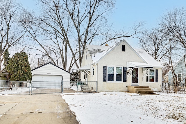 bungalow-style home with a garage