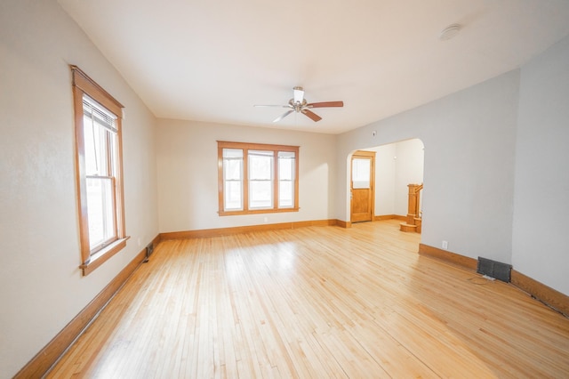 spare room featuring ceiling fan and light hardwood / wood-style floors