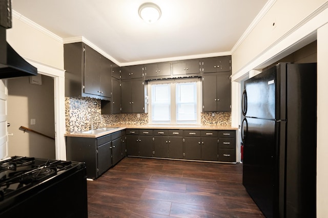 kitchen with sink, dark wood-type flooring, ornamental molding, and black appliances