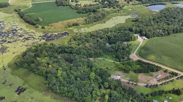 birds eye view of property with a water view and a rural view