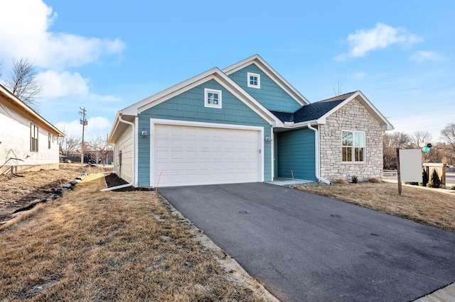 view of front of property with a garage and a front yard