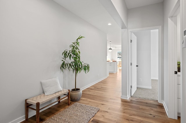 corridor with light wood-type flooring