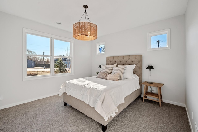 bedroom featuring carpet floors and multiple windows