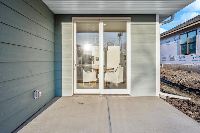 property entrance with a patio area