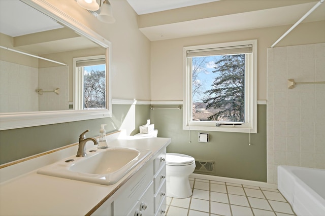 full bathroom with visible vents, toilet, washtub / shower combination, tile patterned flooring, and vanity