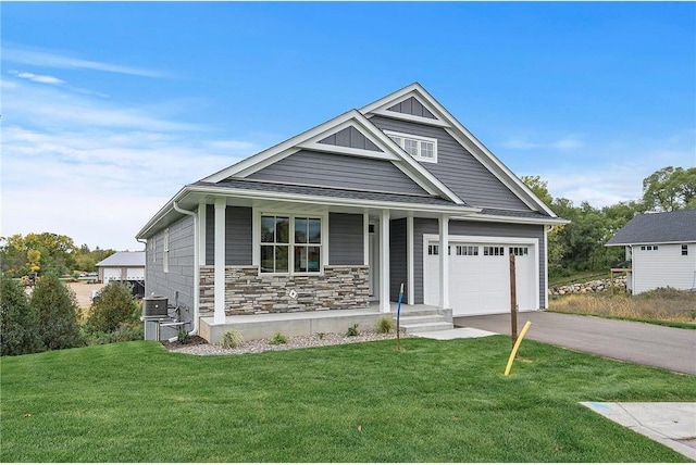 view of front facade with a porch, cooling unit, and a front lawn