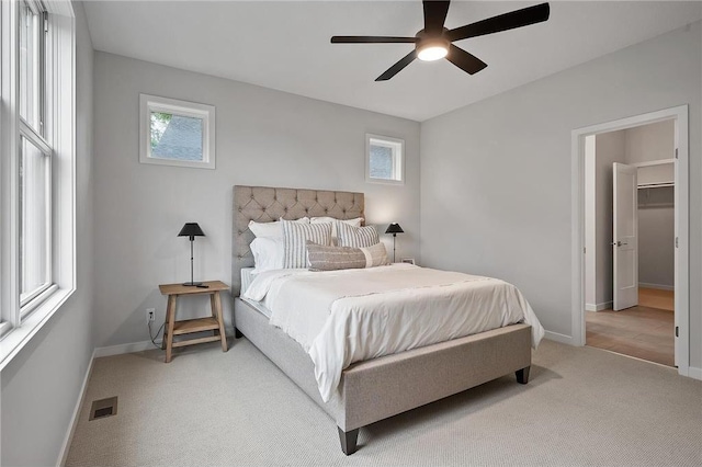 bedroom featuring ceiling fan and carpet