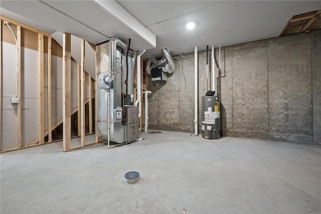 basement with water heater and heating unit