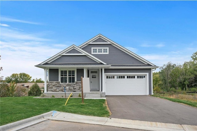 craftsman-style home featuring a garage and a front lawn