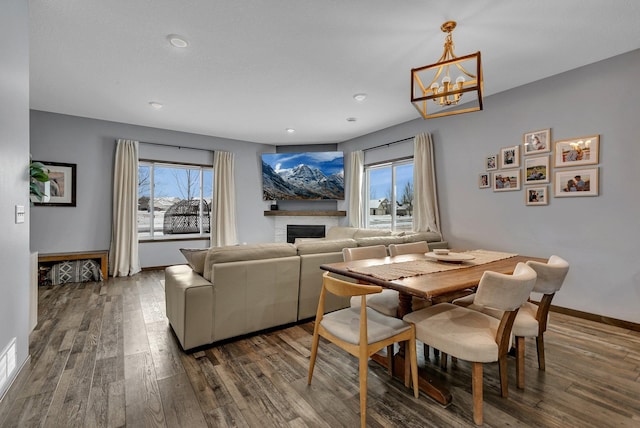 dining room featuring hardwood / wood-style floors and a notable chandelier