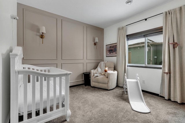 bedroom with light colored carpet and a crib