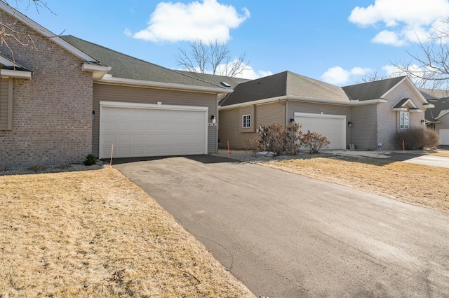 single story home with a garage