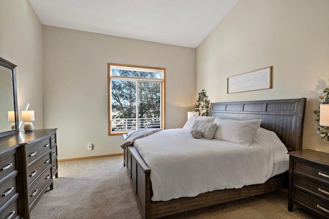 bedroom featuring light colored carpet